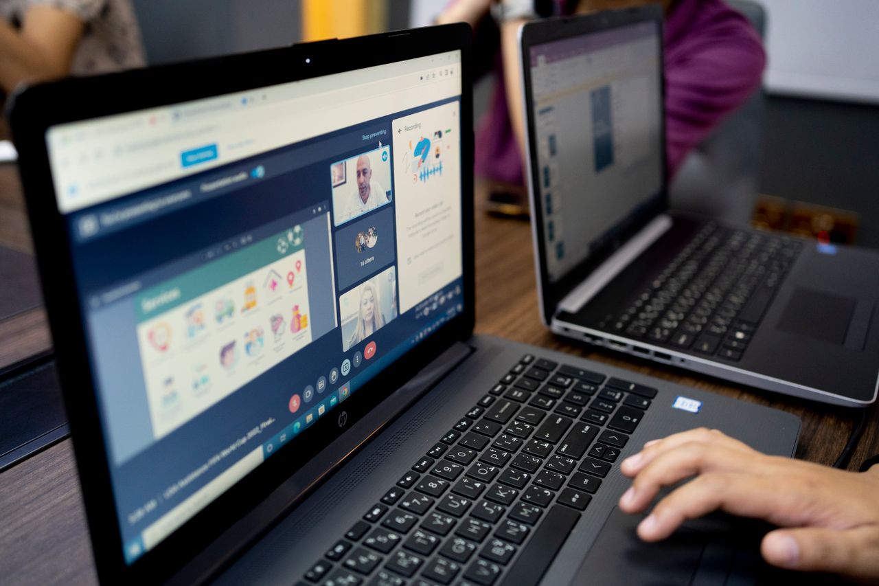 Learners attending a live online class on their laptops